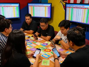 Gathering analyzing Pengeluaran HK data and Togel Hongkong results in a lively setting.
