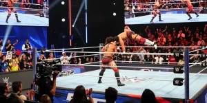 WWE SmackDown event with excited fans and thrilling wrestling action captured during a live match.